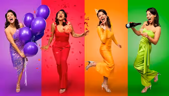 Four women, each dressed in bright outfits (purple, red, yellow, green), pose joyfully against matching colorful backgrounds. They hold balloons, petals, cake, and champagne, celebrating enthusiastically.